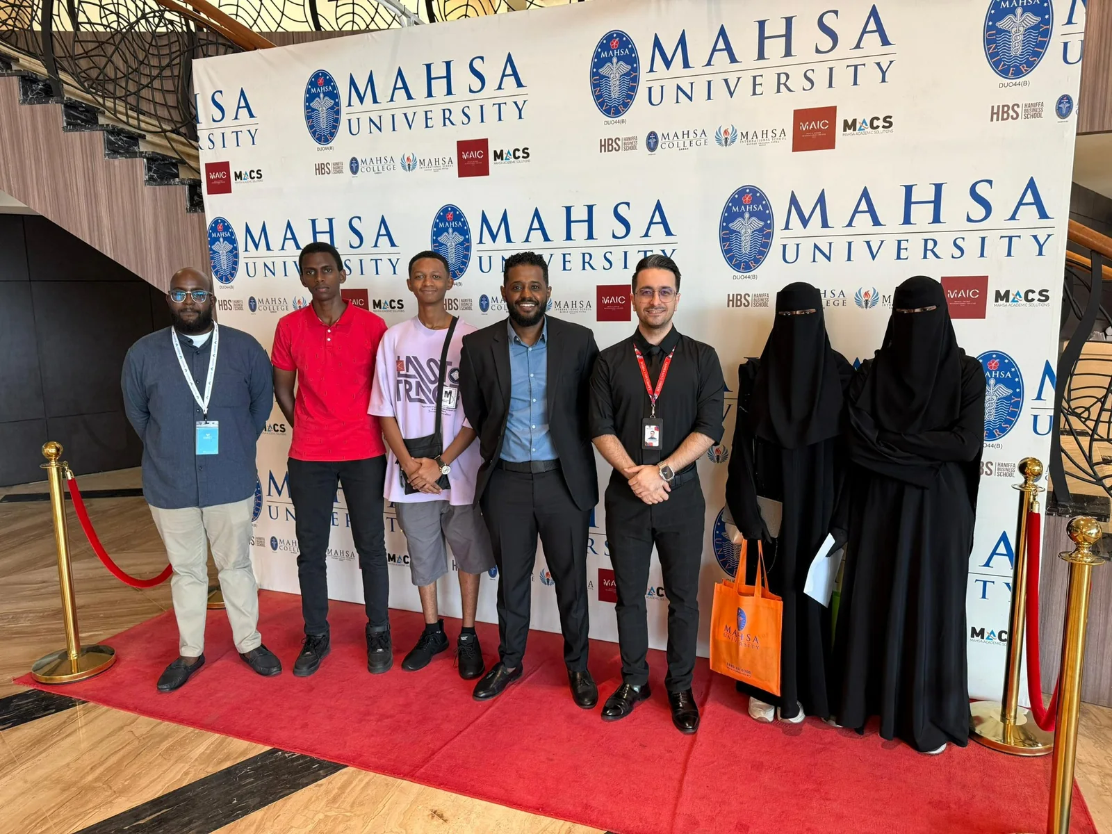 A gathering of students, the Majesty team and university partners